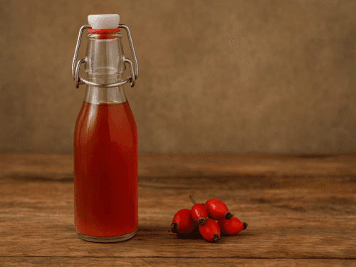 bottle of homemade rosehip syrup